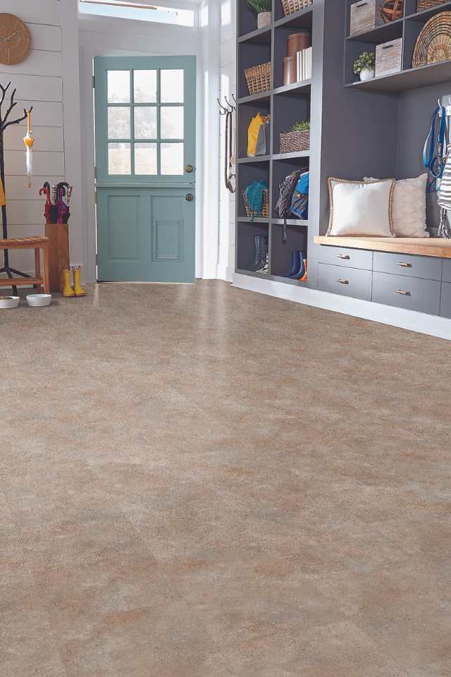 stone look luxury vinyl tile in contemporary entryway with custom built mudroom bench